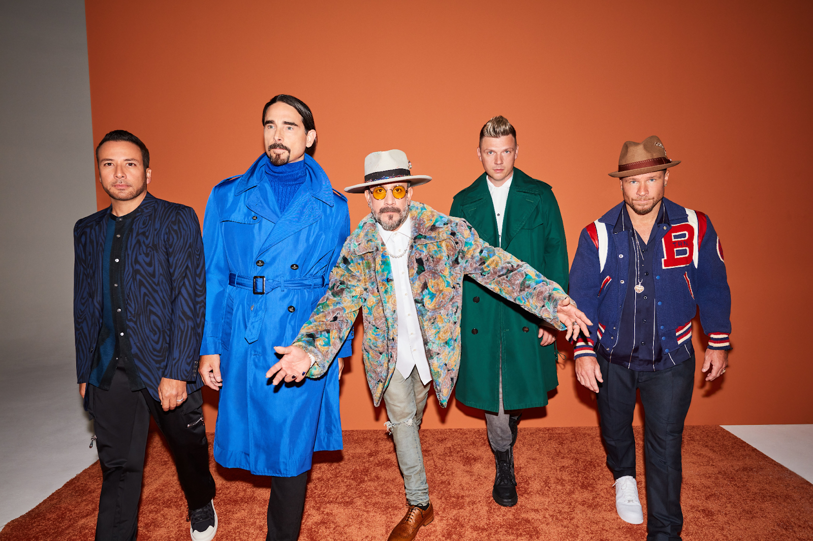 A group of men posing for a picture
Description automatically generated with medium confidence